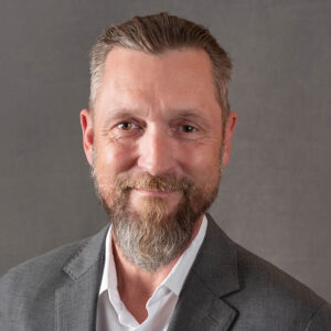 Portrait of Jacob Fox looking at the camera and smiling