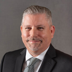 Portrait of Jim Kruse looking at the camera and smiling