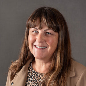 Portrait of Pam Parr looking at the camera and smiling